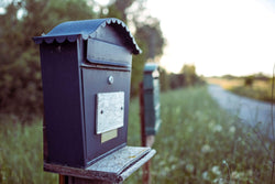 Navy dropbox-stype residential mailbox