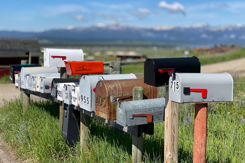 row of mailboxes at different heights